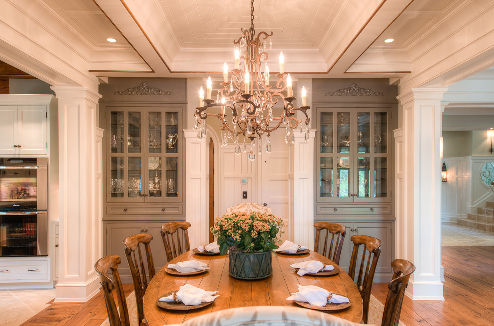 This is an example of a traditional kitchen/dining combo in Charleston with medium hardwood floors.