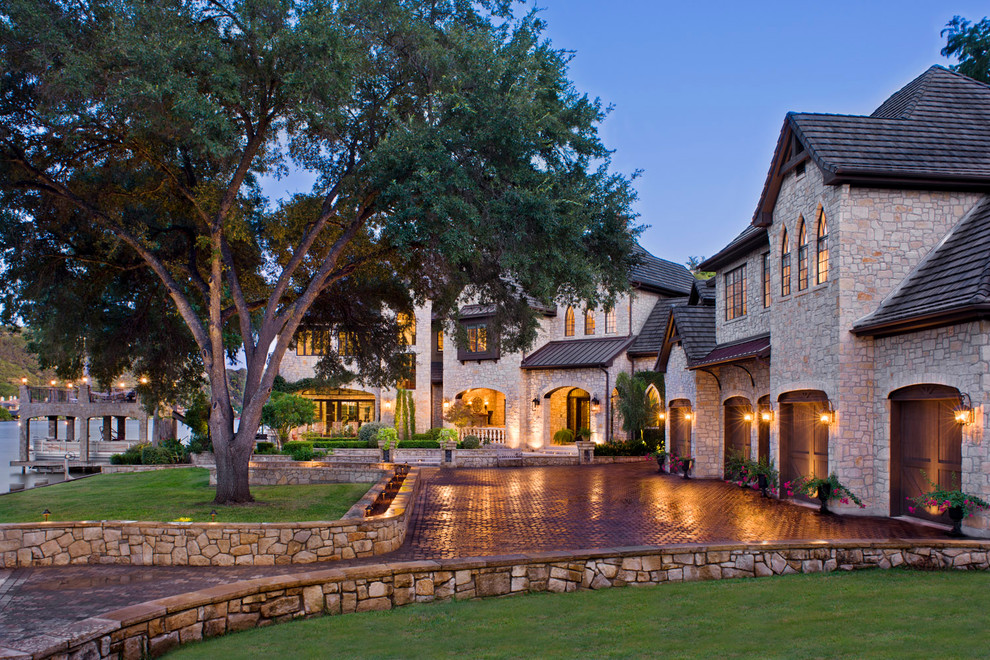 Inspiration for a traditional exterior in Austin with stone veneer.