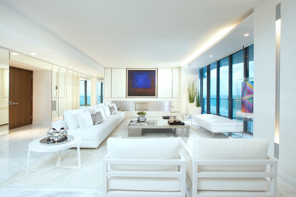 This is an example of an expansive contemporary formal open concept living room in Miami with white walls, marble floors, a ribbon fireplace, a metal fireplace surround and no tv.
