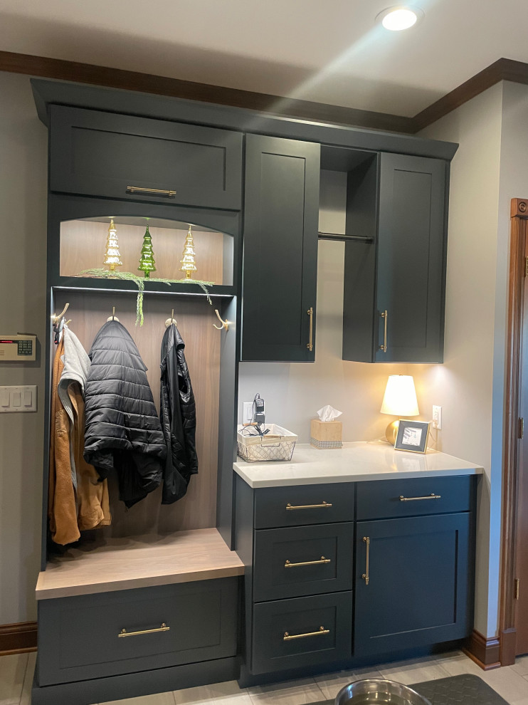Photo of a small transitional mudroom in Other with ceramic floors and grey floor.