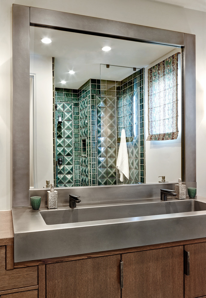 Mid-sized mediterranean bathroom in Phoenix with a trough sink, flat-panel cabinets, dark wood cabinets, green tile, white walls, an alcove shower, ceramic tile, wood benchtops and brown benchtops.