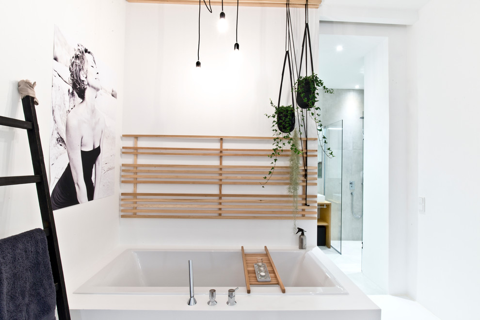Inspiration for a mid-sized industrial master bathroom in Munich with a drop-in tub, white walls, a corner shower and a vessel sink.