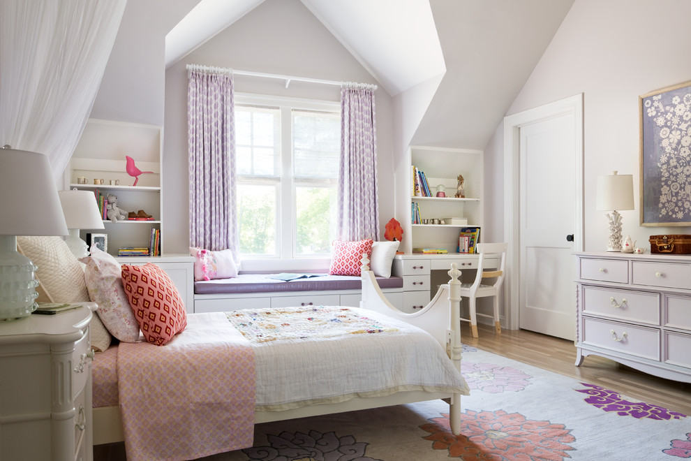 Design ideas for a traditional kids' room for girls in New York with purple walls and medium hardwood floors.