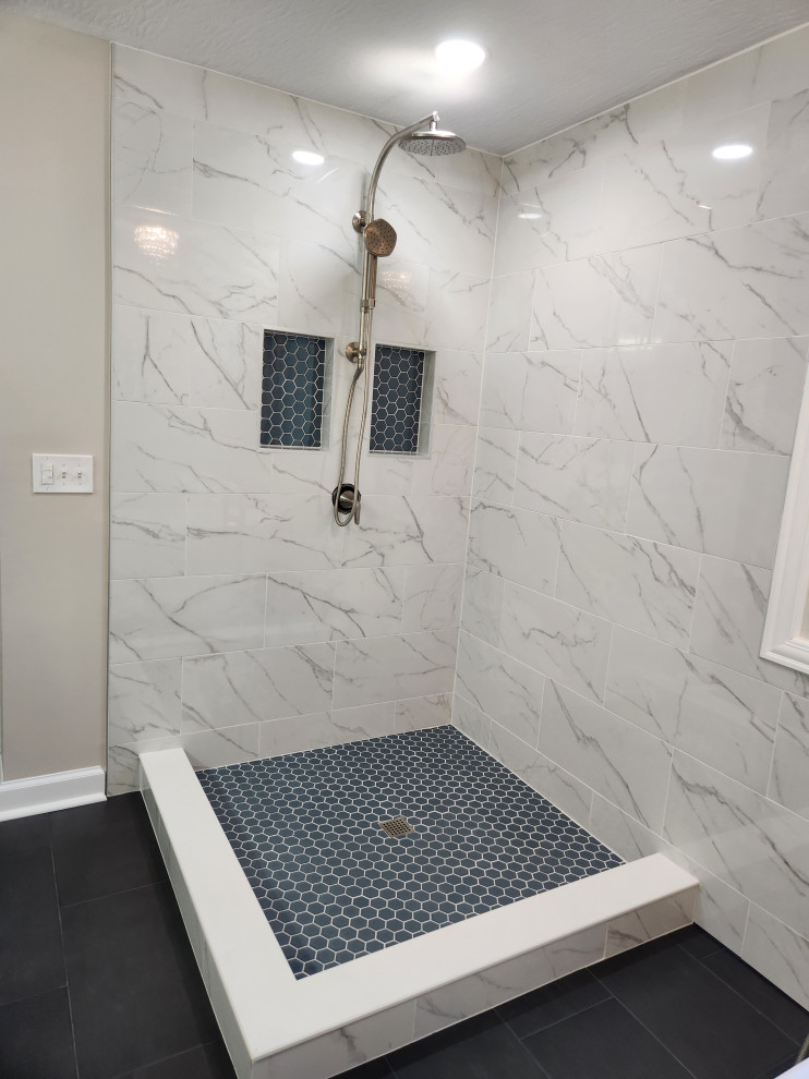 Photo of a large modern ensuite bathroom in Columbus with a corner shower, white tiles, porcelain tiles and a hinged door.
