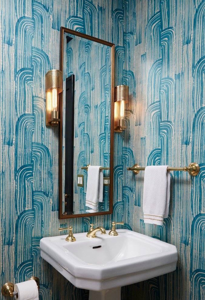Inspiration for a small transitional powder room in Chicago with blue walls and a pedestal sink.