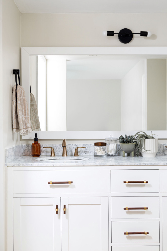 Inspiration for a small master bathroom in Phoenix with shaker cabinets, white cabinets, a curbless shower, a two-piece toilet, multi-coloured tile, ceramic tile, beige walls, travertine floors, an undermount sink, marble benchtops, beige floor, an open shower, white benchtops, a double vanity and a built-in vanity.