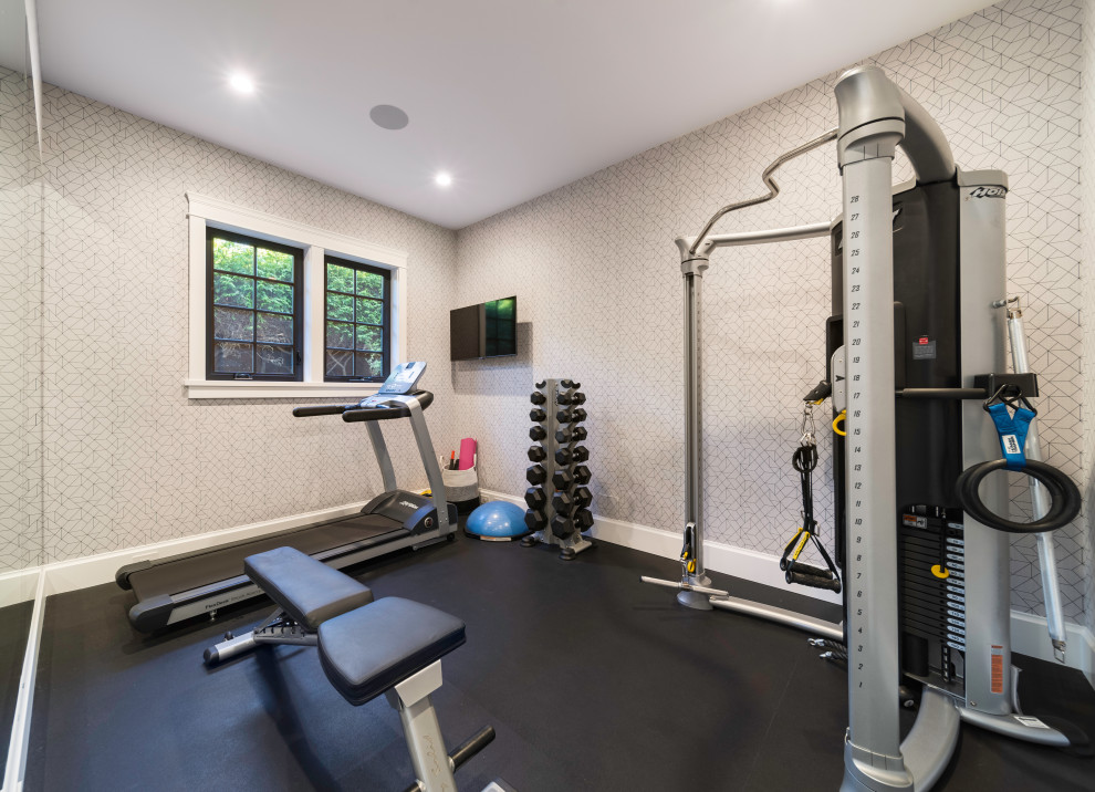 Inspiration for a mid-sized multipurpose gym in Vancouver with white walls and black floor.