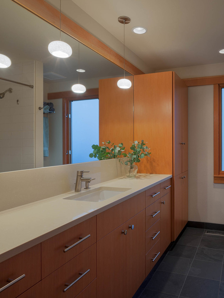 Alcove shower - mid-sized transitional master white tile and ceramic tile slate floor alcove shower idea in Seattle with an undermount sink, flat-panel cabinets, medium tone wood cabinets, quartzite countertops and white walls