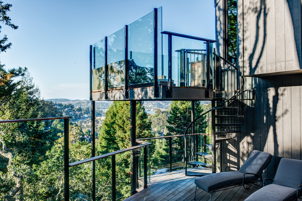 Inspiration for a contemporary balcony in San Francisco with no cover and glass railing.