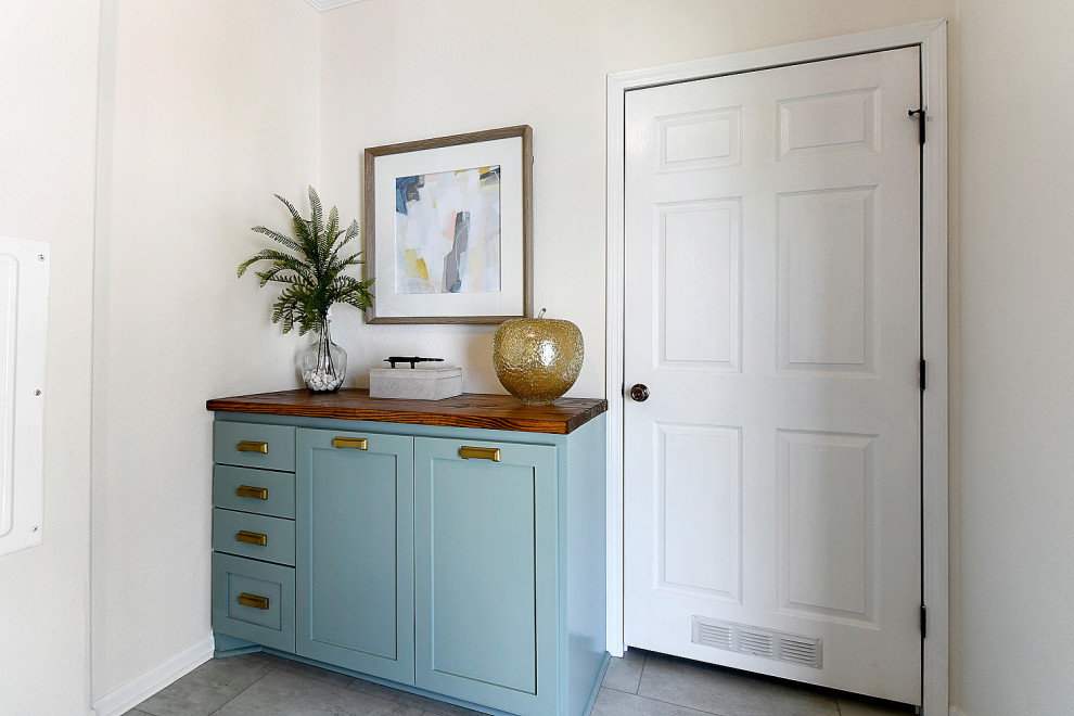 Mid-sized transitional dark wood floor and brown floor foyer photo with white walls and a white front door