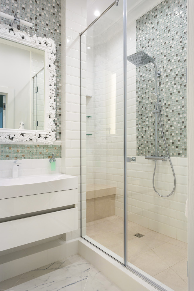 This is an example of a small contemporary kids bathroom in Moscow with flat-panel cabinets, white cabinets, an alcove shower, porcelain floors, white floor, a hinged shower door, white benchtops, gray tile, mosaic tile and a console sink.