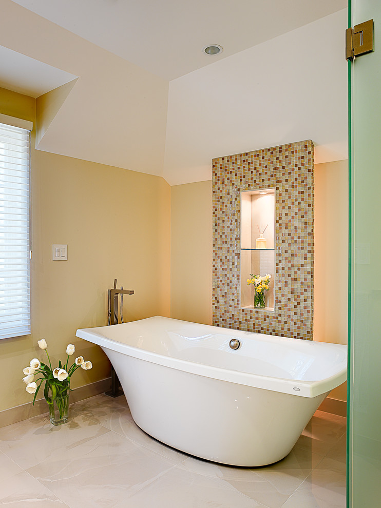 This is an example of a contemporary bathroom in San Francisco with a freestanding tub and mosaic tile.