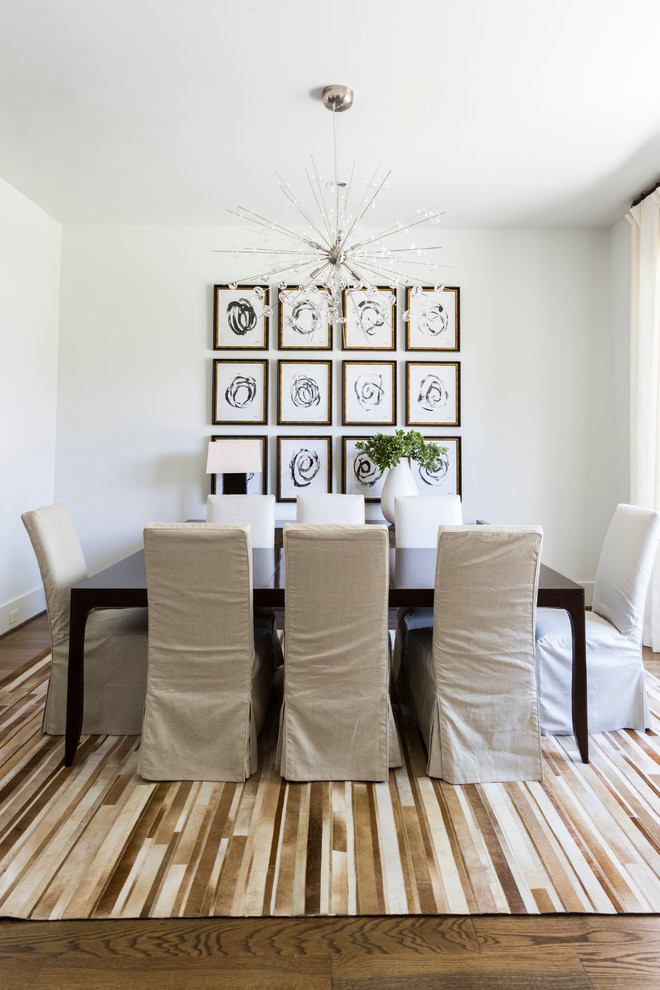 Transitional dining room in Houston with white walls and dark hardwood floors.