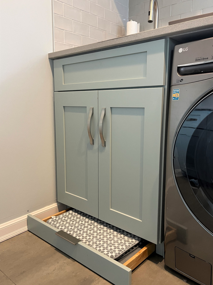 Inspiration for a large galley dedicated laundry room in Detroit with an undermount sink, shaker cabinets, turquoise cabinets, quartz benchtops, white splashback, subway tile splashback, white walls, porcelain floors, a side-by-side washer and dryer, grey floor and grey benchtop.