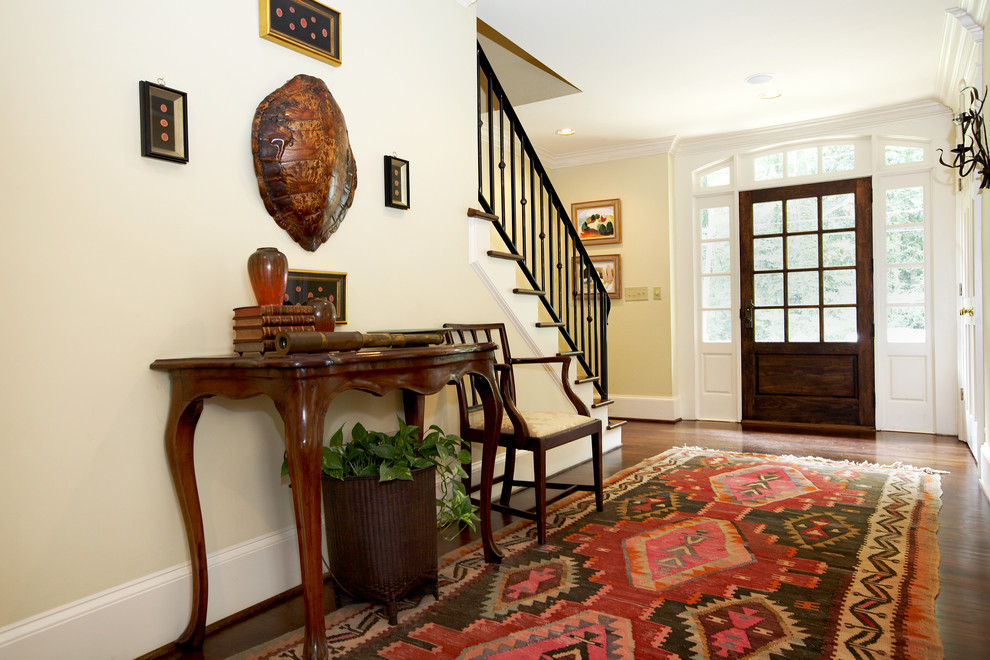 This is an example of a traditional entryway in Atlanta with a glass front door.