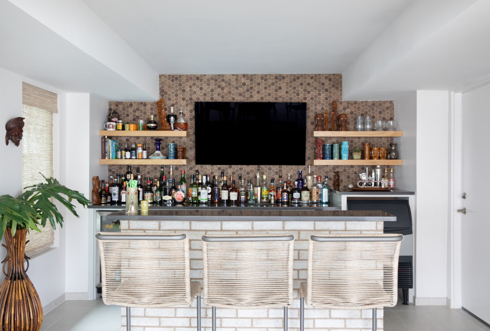 Inspiration for a contemporary galley home bar with brown splashback, mosaic tile splashback, grey floor and grey benchtop.