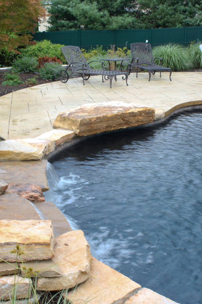 Inspiration for a rustic pool remodel in Boston