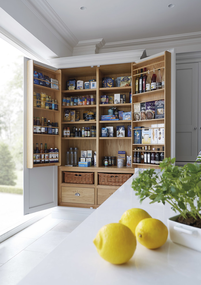This is an example of a kitchen pantry in Manchester with shaker cabinets and grey cabinets.