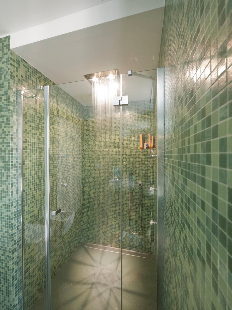 Design ideas for a small modern master bathroom in Milan with a console sink, an alcove shower, a two-piece toilet, green tile, mosaic tile, green walls and ceramic floors.