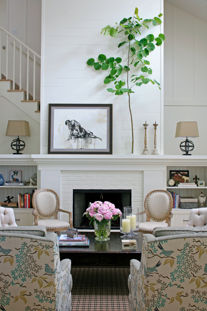 This is an example of a traditional living room in Other with white walls.
