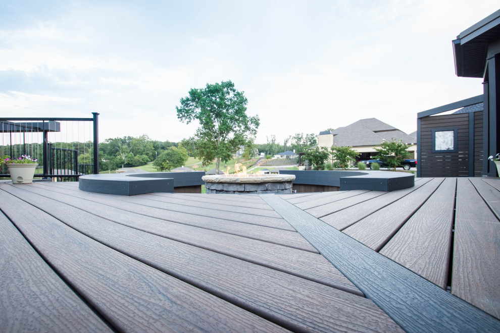 Inspiration for a large transitional backyard deck remodel with a fire pit and no cover