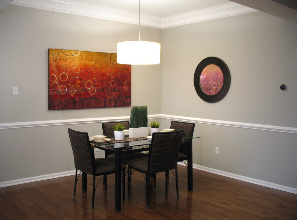 Inspiration for a small contemporary medium tone wood floor dining room remodel in Philadelphia with gray walls