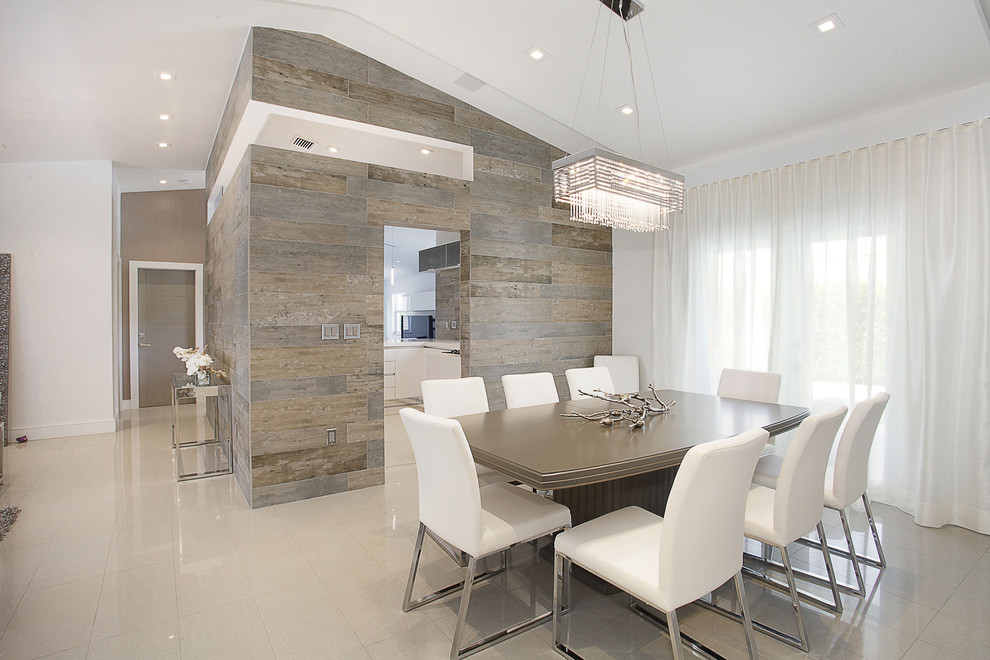 Photo of a mid-sized contemporary separate dining room in Miami with white walls and no fireplace.