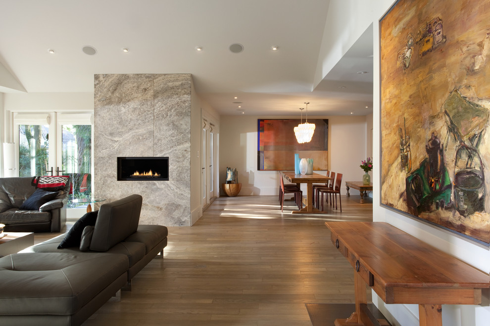 Modern open concept living room in Vancouver with a ribbon fireplace.