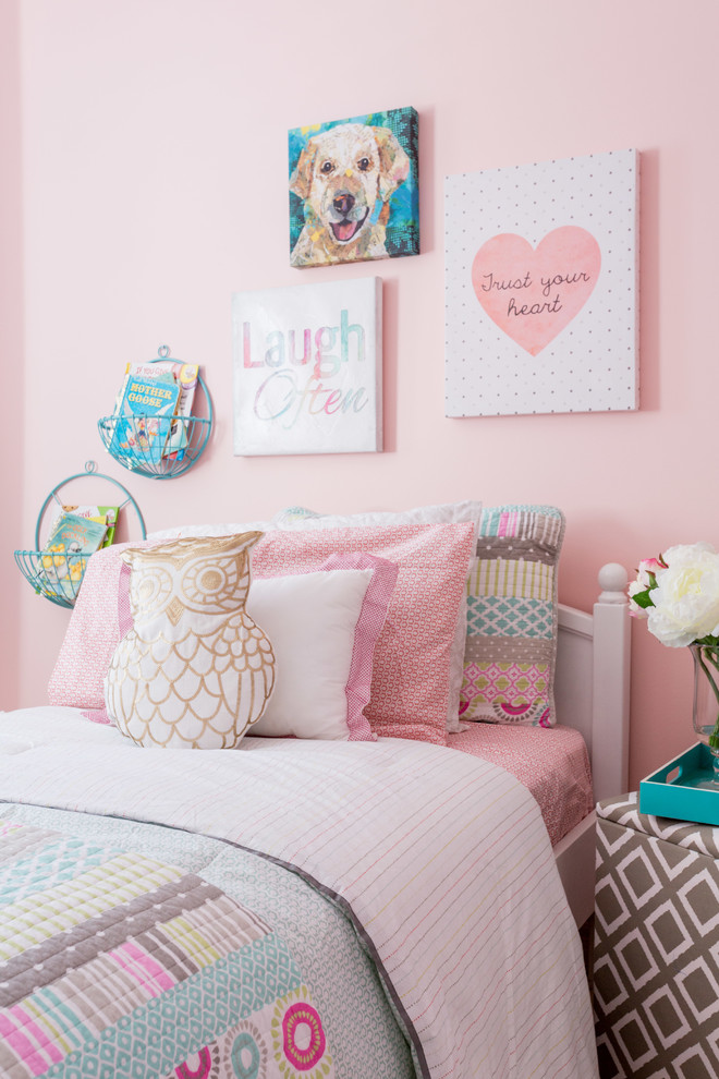 This is an example of a transitional kids' room for girls in Toronto with pink walls and carpet.