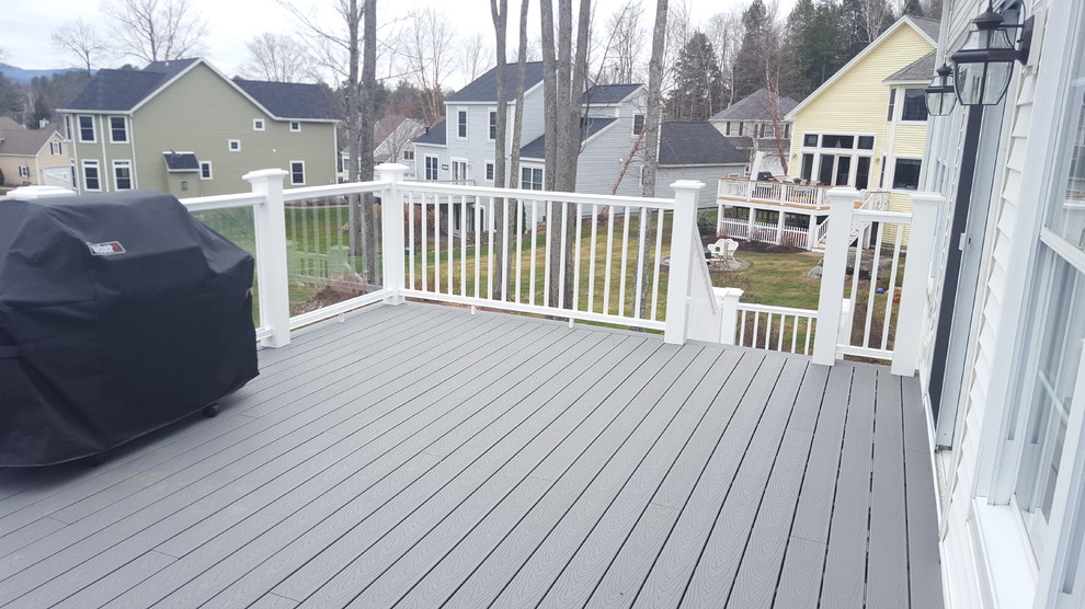 Deck - large modern backyard deck idea in Boston with no cover