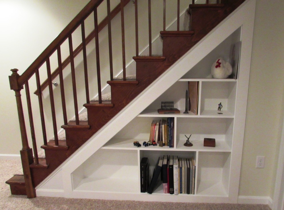 This is an example of a mid-sized transitional wood straight staircase in DC Metro with wood risers and wood railing.