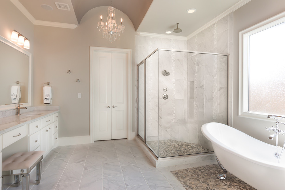 Design ideas for a large contemporary master bathroom in Houston with a drop-in sink, raised-panel cabinets, white cabinets, granite benchtops, a claw-foot tub, a corner shower, gray tile, ceramic tile, yellow walls and mosaic tile floors.