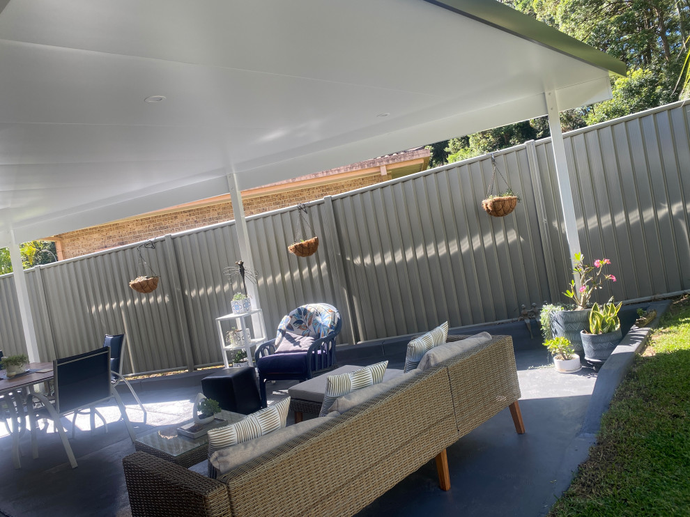 Mid-sized modern backyard patio in Other.