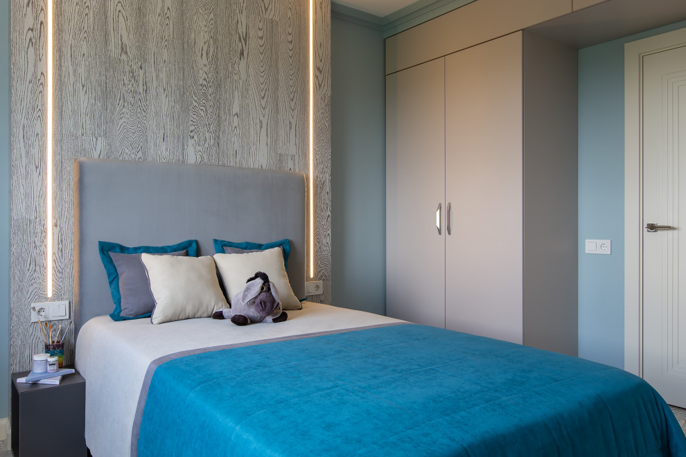 This is an example of a mid-sized contemporary kids' room for boys in Moscow with blue walls, cork floors, grey floor, recessed and decorative wall panelling.