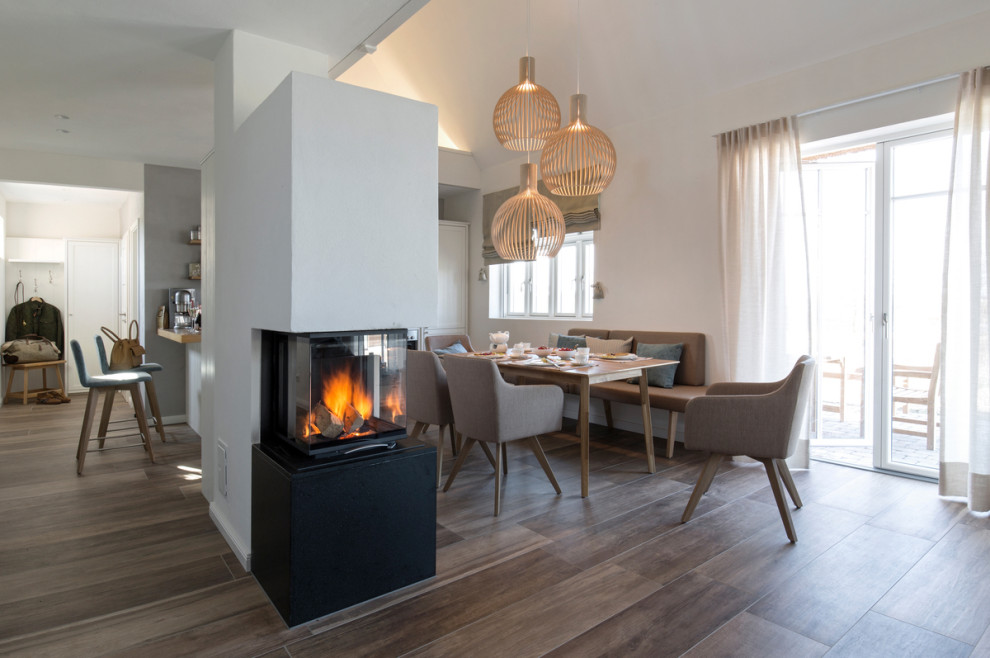 Inspiration for an expansive country open concept living room in Munich with white walls and a wood stove.