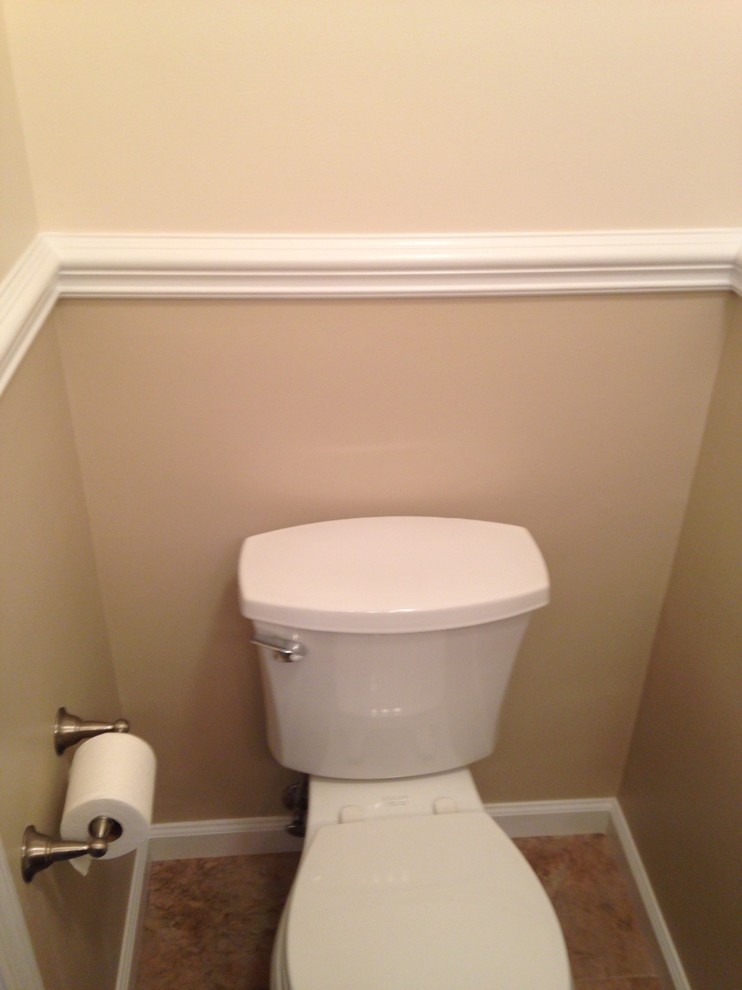 Home design - small transitional beige tile and porcelain tile porcelain tile home design idea with an undermount sink, shaker cabinets, dark wood cabinets, granite countertops, a two-piece toilet and beige walls