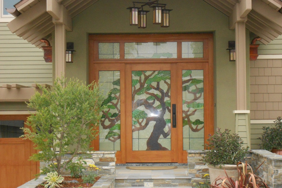 Contemporary front door in San Diego with green walls, a single front door and a light wood front door.
