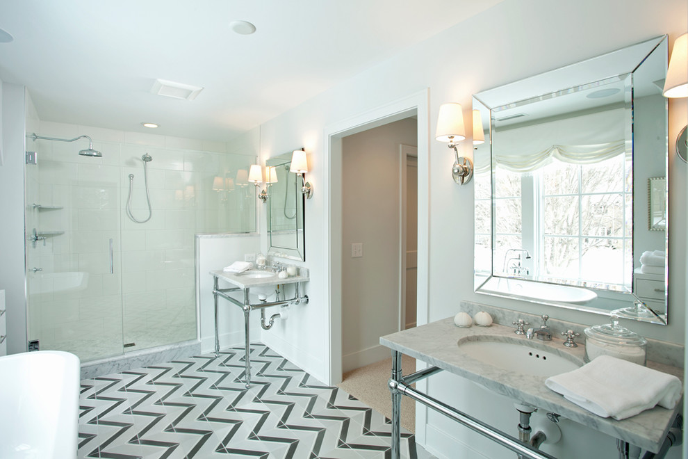 This is an example of a transitional bathroom in Minneapolis with marble benchtops, a console sink and multi-coloured floor.