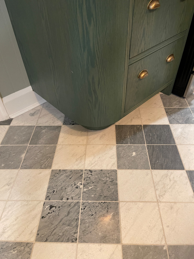 Mid-sized transitional marble floor and multicolored floor kitchen photo with green cabinets, quartz countertops, white backsplash, quartz backsplash, stainless steel appliances and white countertops