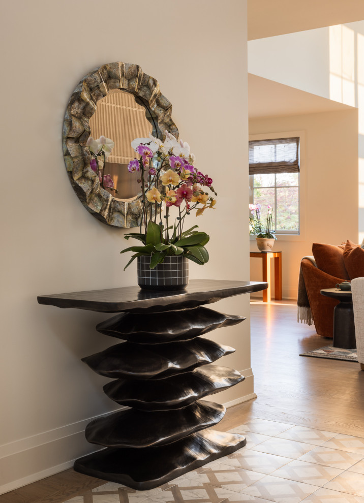 Mid-sized transitional porcelain tile entryway photo in New York with white walls