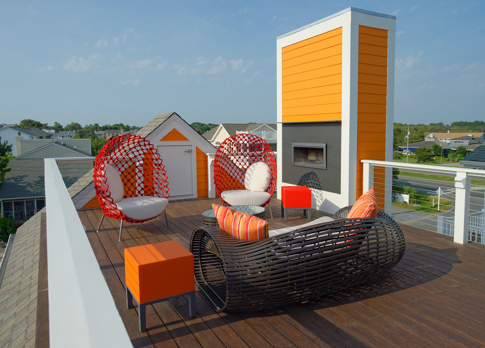 Design ideas for a beach style rooftop deck in Other with a fire feature.