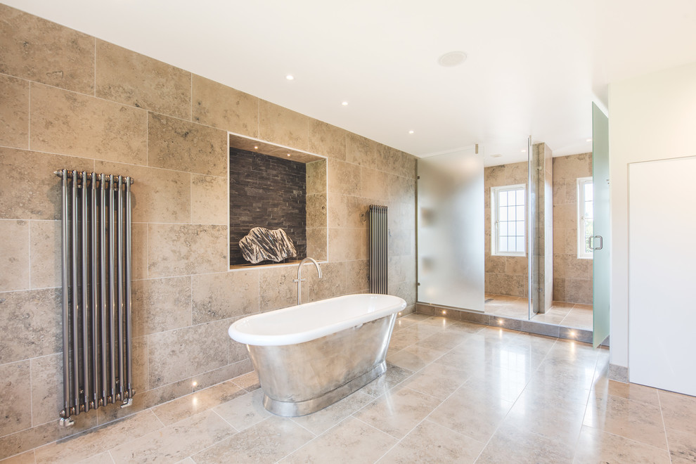 This is an example of a transitional bathroom in Berkshire with a freestanding tub and white walls.