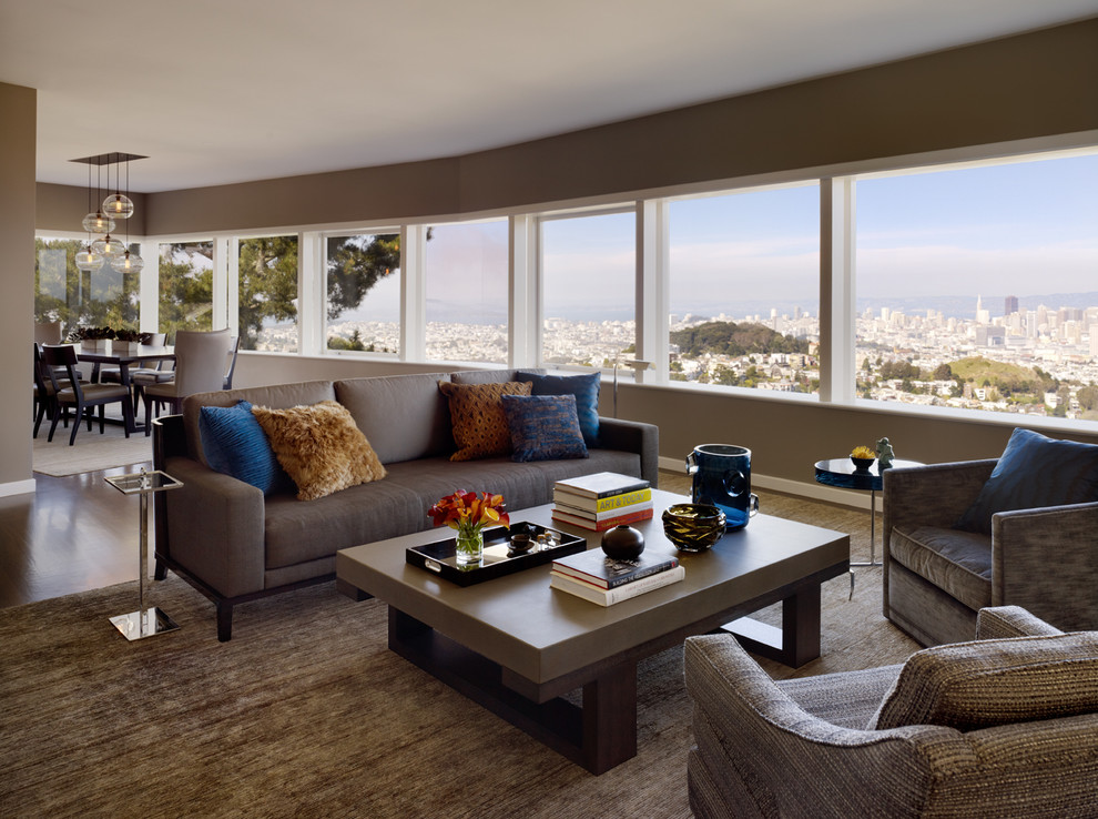 Inspiration for a contemporary open concept living room in San Francisco with brown walls.