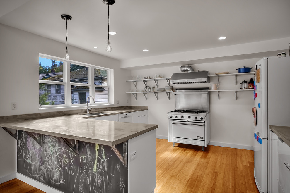 Photo of a modern l-shaped kitchen in Seattle with open cabinets and white appliances.