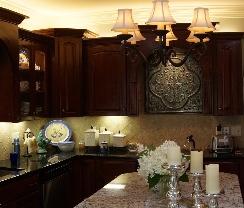 Large transitional u-shaped eat-in kitchen photo with raised-panel cabinets, granite countertops and an island