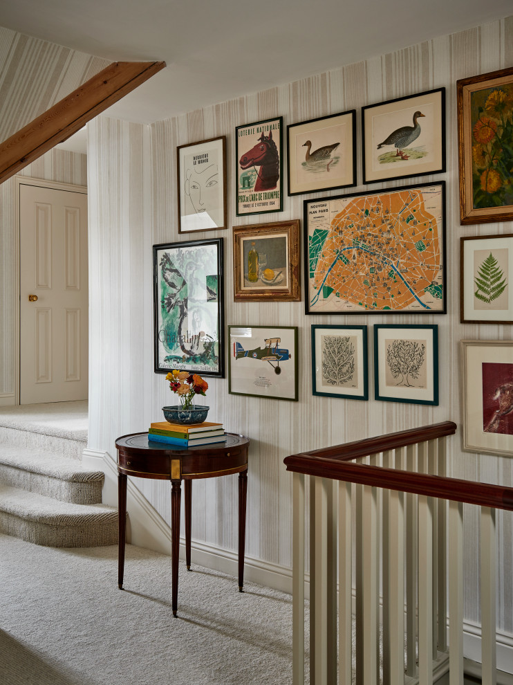 This is an example of a traditional hallway in Wiltshire with multi-coloured walls, carpet and beige floor.