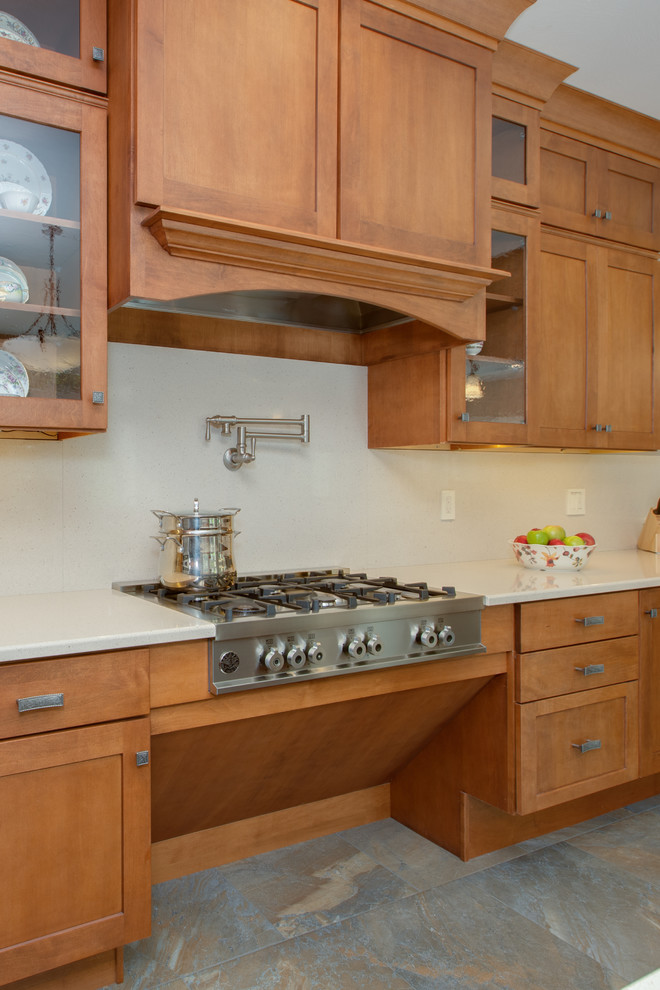 Huge transitional u-shaped open concept kitchen photo in Boston with an undermount sink, shaker cabinets, medium tone wood cabinets, quartz countertops, stone slab backsplash, stainless steel appliances and an island