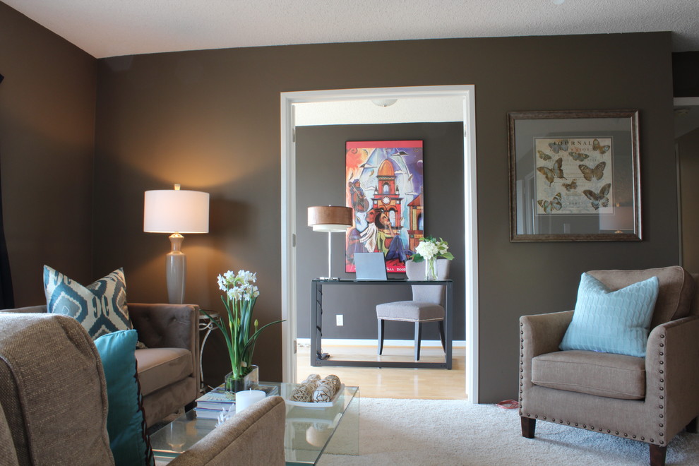 Photo of a small contemporary open concept living room in Kansas City with brown walls, carpet and no fireplace.