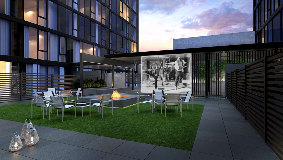Design ideas for an expansive contemporary courtyard partial sun garden in New York with a fire feature.