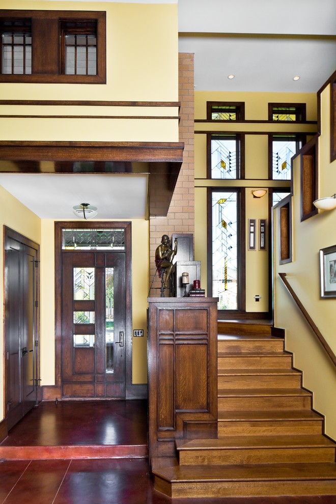 Design ideas for an arts and crafts entryway in Denver with yellow walls.